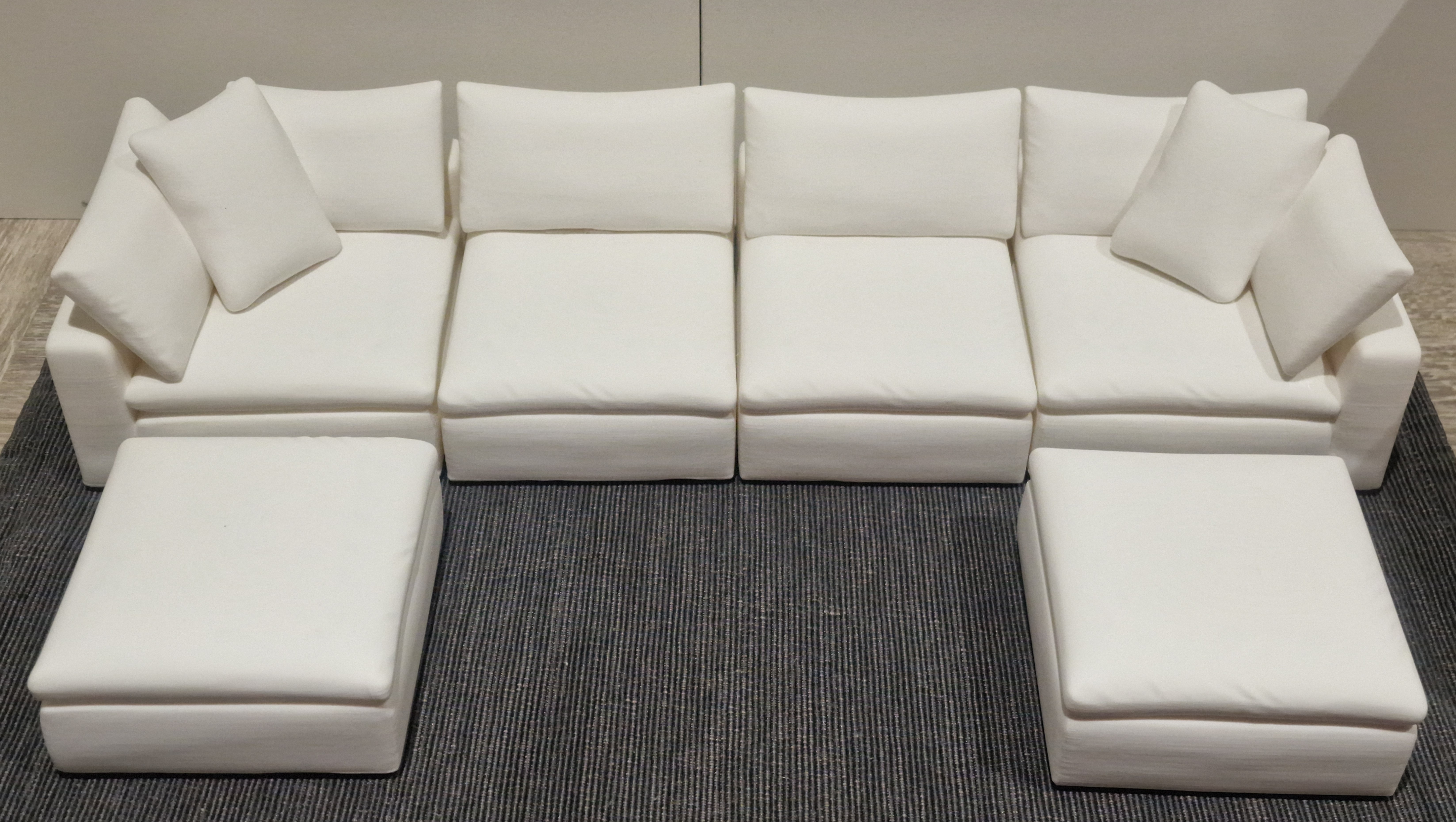 White 3D printed miniature sofa seat module with a shaped seat cushion and backrest.